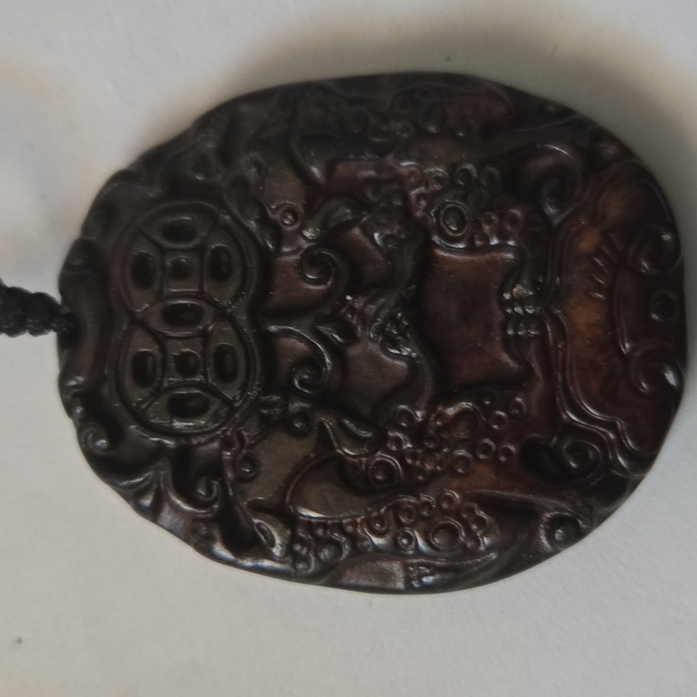 Dark brown jade pendant